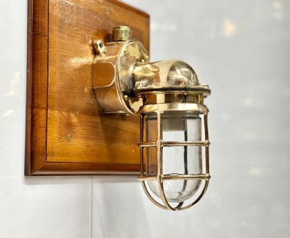 Vintage marine nautical solid brass swan passageway bulkhead light fixture, perfect for coastal and industrial-themed decor.