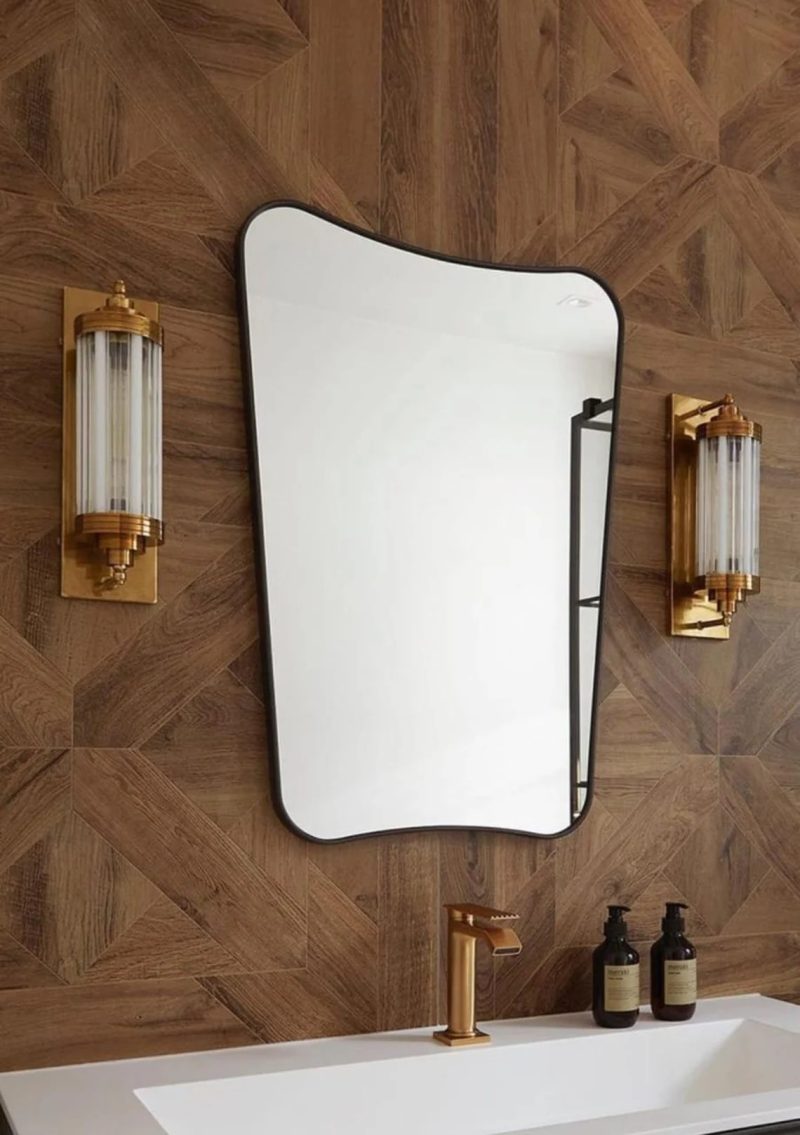 A pair of vintage Art Deco skyscraper-style wall sconces made of brass with milk glass rods, measuring 17 inches in length, 4.5 inches in breadth, and 5 inches in width.