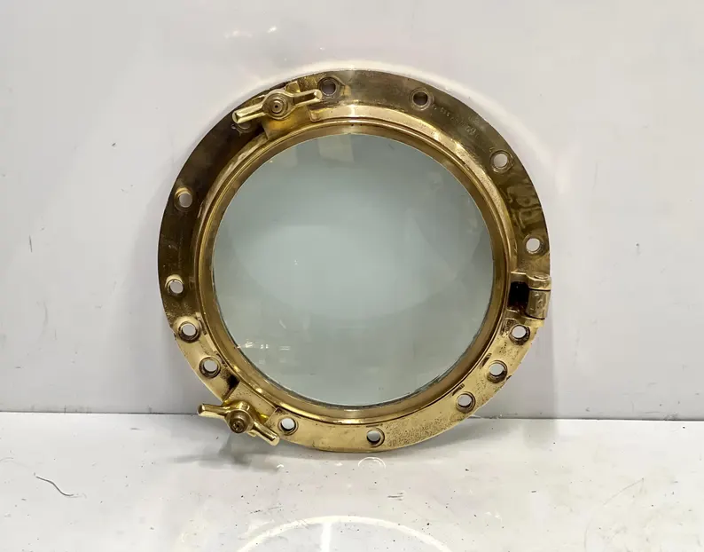 53d Solid brass ship porthole window with clear glass and hinged locking lugs – authentic nautical wall décor and marine mirror frame.