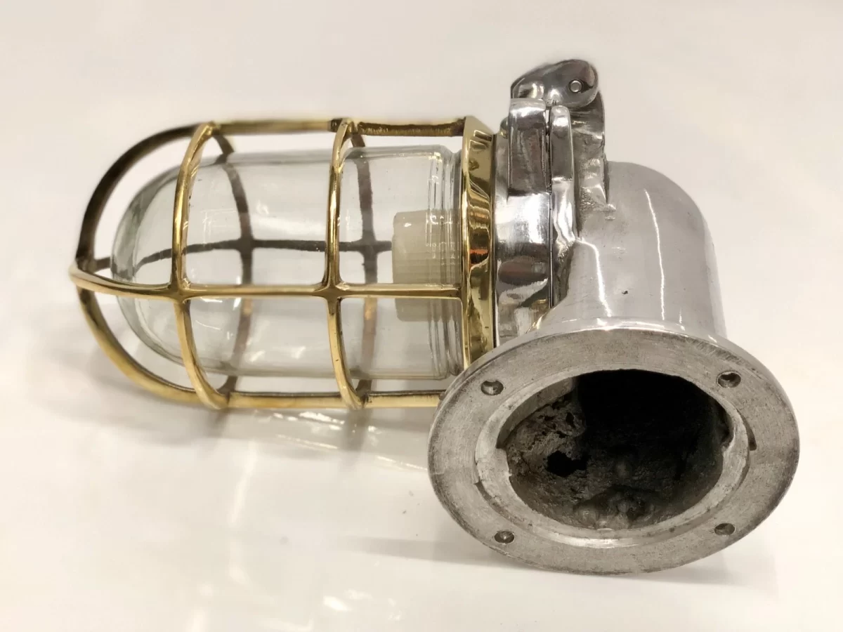 Vintage nautical bulkhead wall light with brass cage, glass cover, and wooden base – industrial marine wall sconce