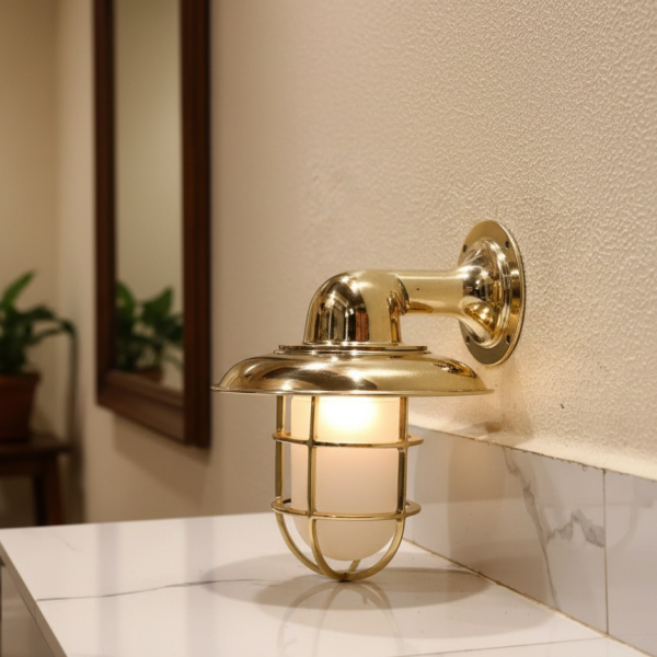 Brass nautical bulkhead wall light with frosted glass and protective cage, 12-inch marine style wall sconce.