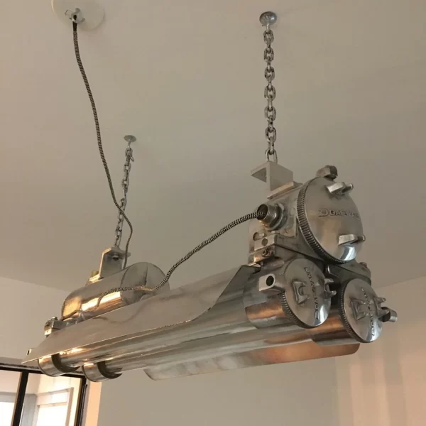 Vintage polished Daeyang flameproof strip light from 1978, restored explosion proof industrial pendant lamp with aluminum body, brass fittings, and dual LED tubes.